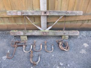 A collection of telegraph pole crossarms parts awaiting restoration
