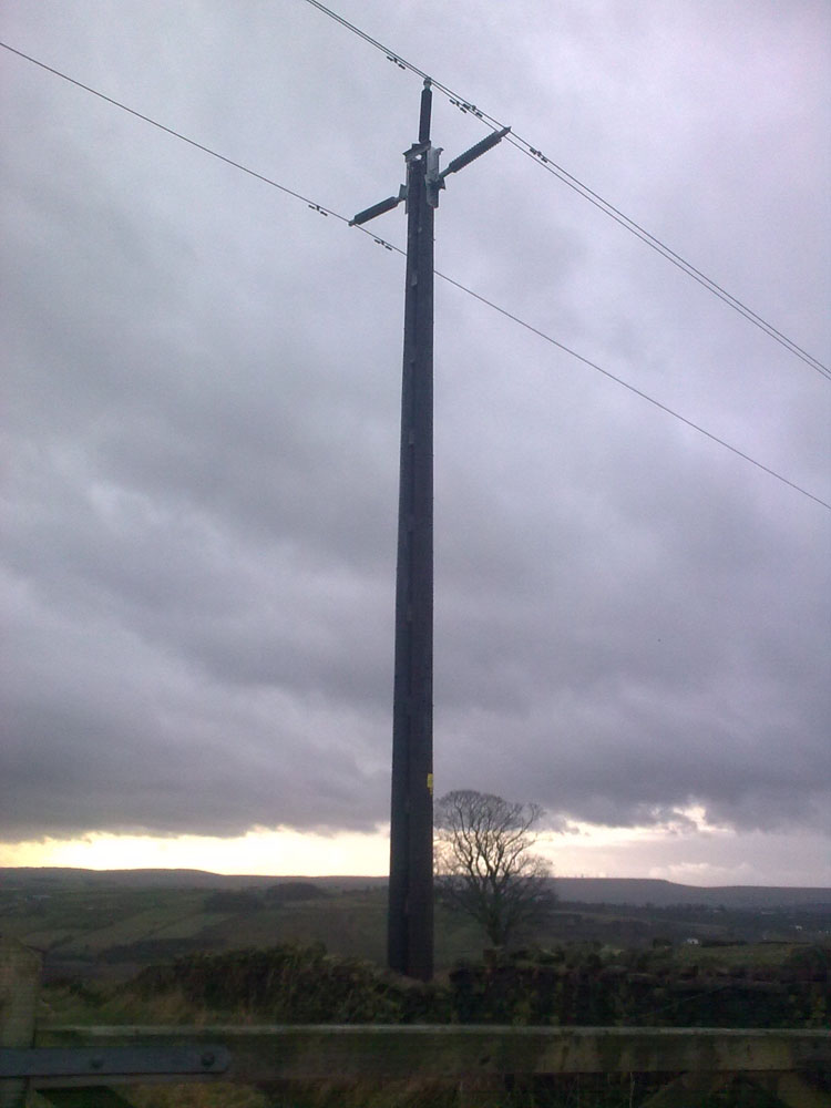 New fangled electricity being transported to Keighley up a pole A powerful power pole above Keighley