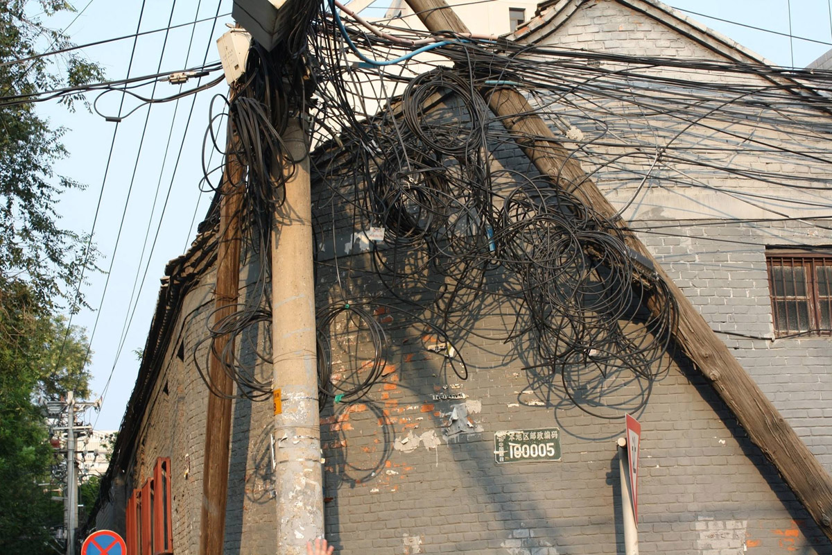 A tangled telephone pole in Beijing