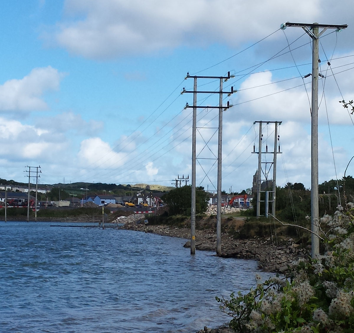 There's lovely at Hayle, Cornwall. A line of electricity poles crossing a tidal pool in Cornwall