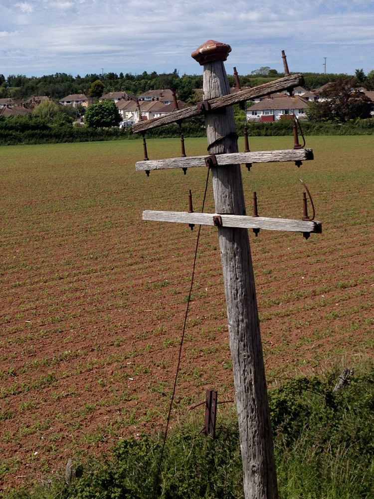 A very old pole trackside of the West Somerset Railway.