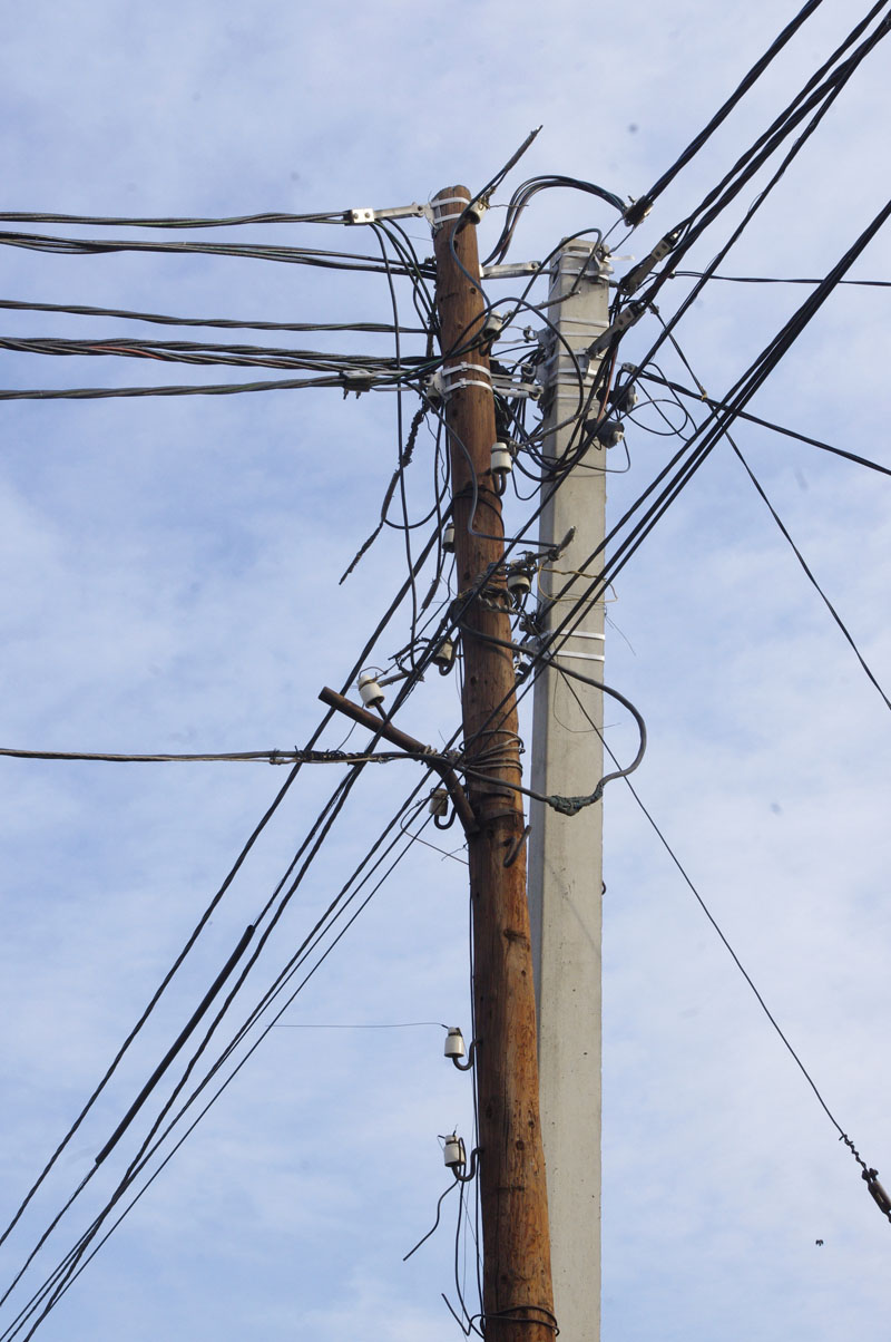 Tangled utility cables atop a utility pole, Almaty, Kazhakstan