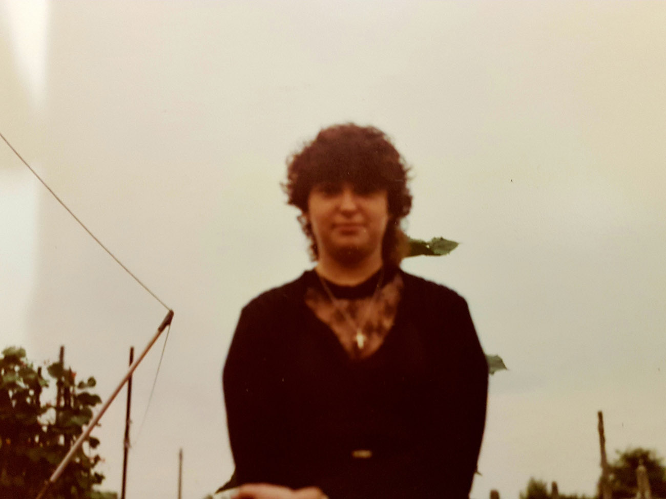 Her Indoors in front of a leaning pole. michael donnithorne's missus
