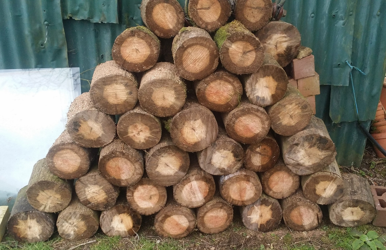 An act of unprecedented evil. A pile of logs made of telegraph poles