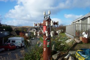 A former telegraph pole now rerouted as a bird feeder.