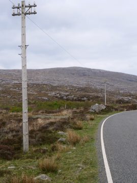 Pair of 2 armed pole with insulators on A859 through Harris en route to Lewis